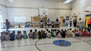 Young students wait to receive their donated toys. 