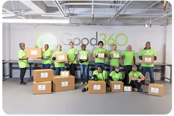 Good360 distributes product donations directly to people in need. Here are some of our volunteers with donated goods. 